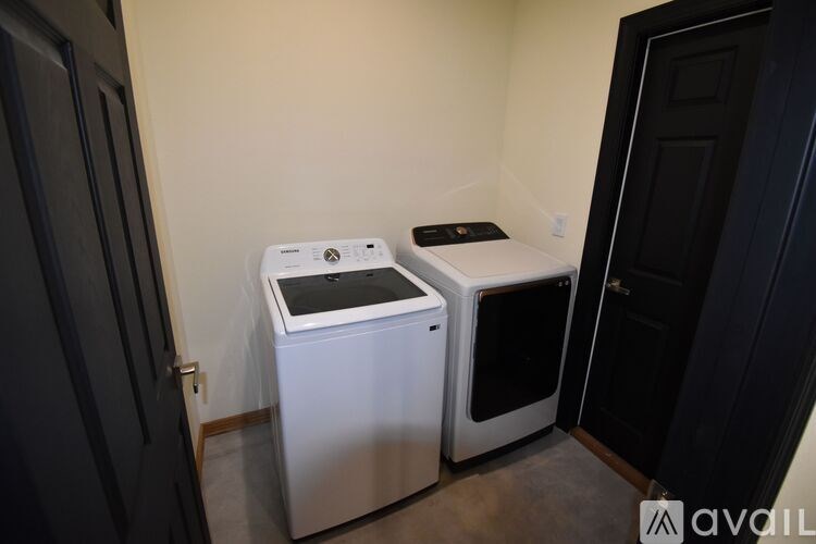 A white dishwasher and a white oven in a kitchen.