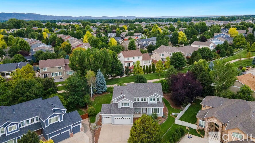 A suburban neighborhood with houses and trees.