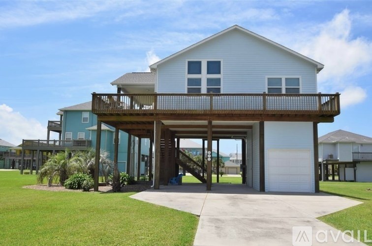 A two-story house with a balcony is for sale.