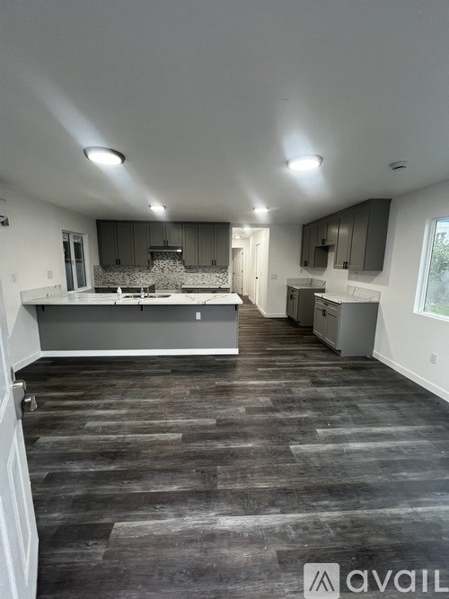 A spacious kitchen with a large island in the middle.