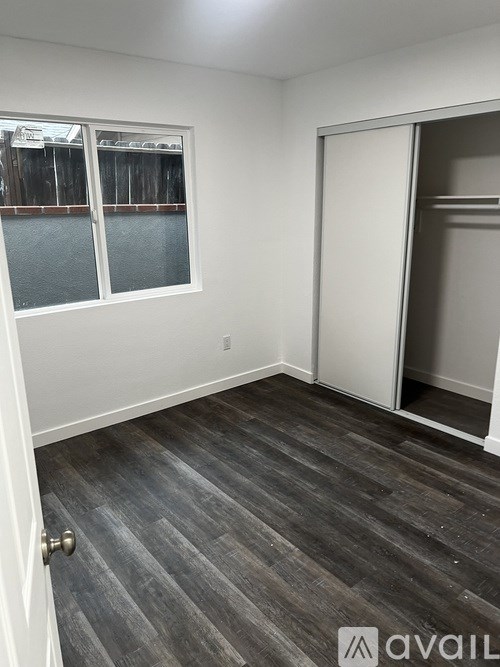 A room with a sliding door and a window.