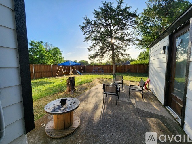 A patio with a table and chairs is shown in the image.