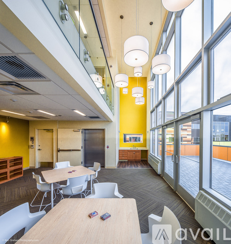 A conference room with a long table and chairs.