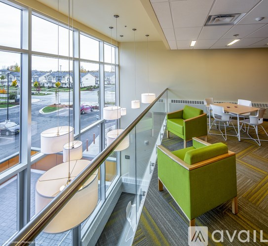 A view of a cafeteria with tables and chairs.