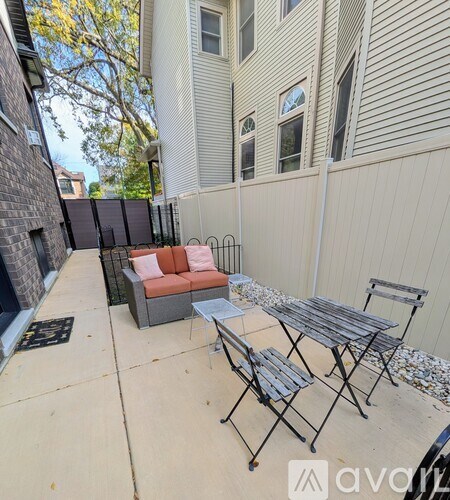 A patio with a table and chairs is shown.