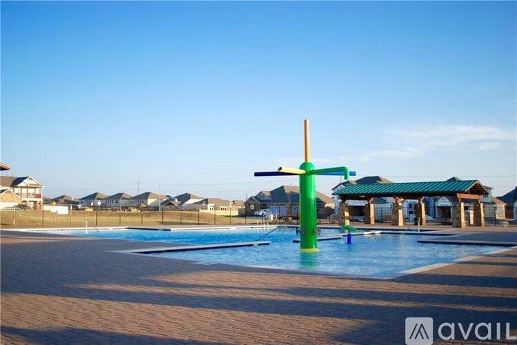 A pool with a green pole in the middle of it.