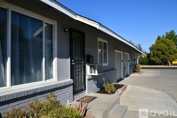 A row of houses with a clear blue sky above.
