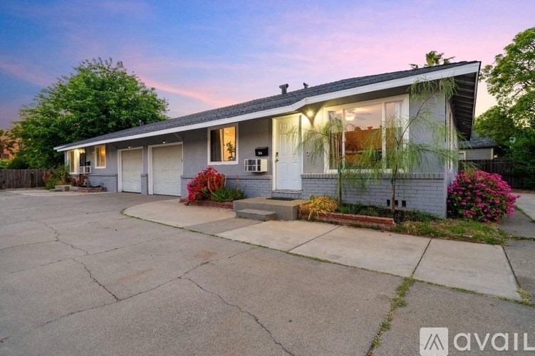 A house with a driveway in front of it.