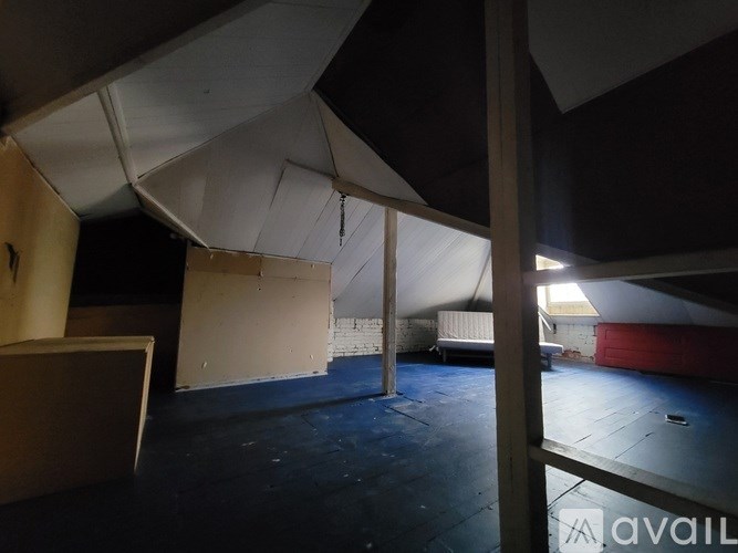 A room with a white canopy and a blue floor.