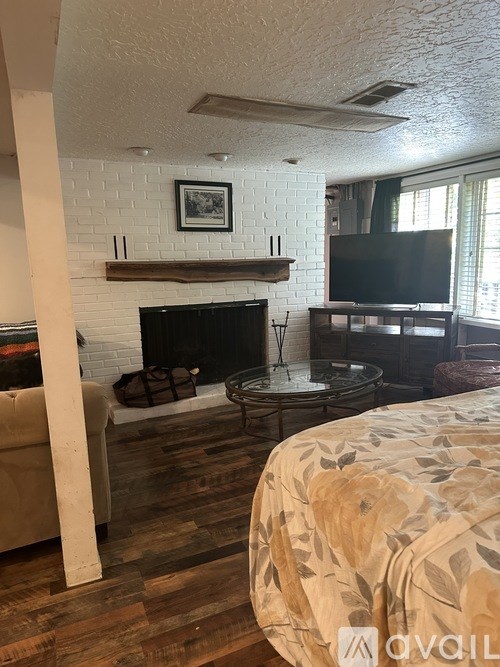 A living room with a fireplace and a couch.