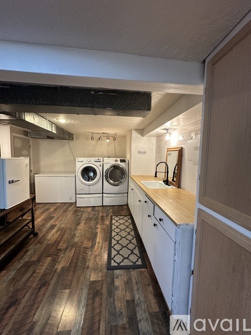 A laundry room with a washer and dryer.