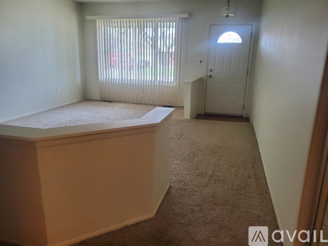 A room with a bed and a door.