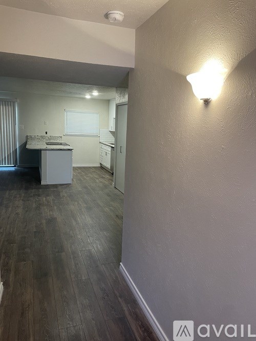 A double sink in a granite countertop with a chrome faucet.