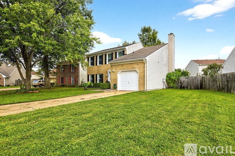 A house with a garage is for sale.