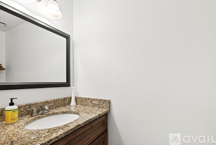 A bathroom sink with a mirror above it.