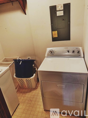 A washing machine and dryer in a small laundry room.