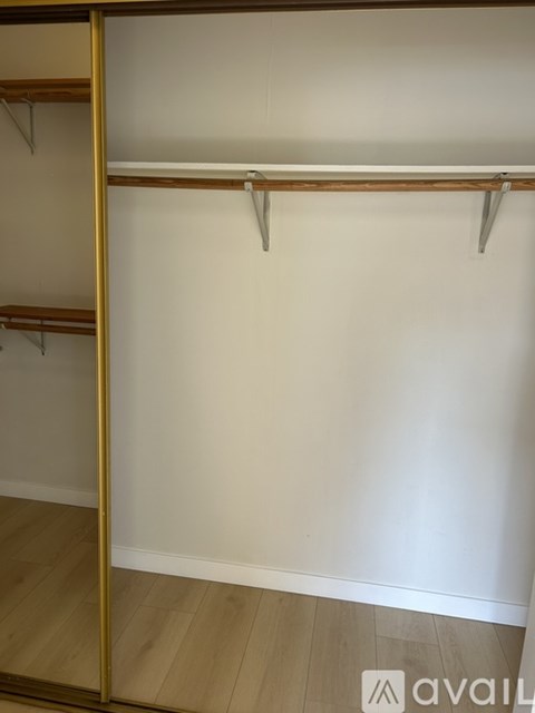 Empty wooden shelves in a room.