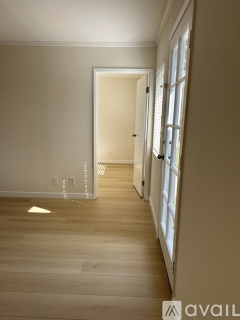 A long hallway with a door at the end.