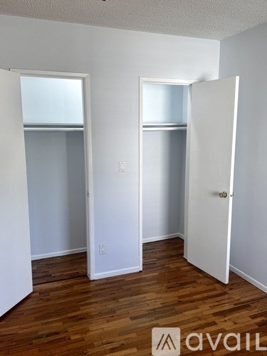 A room with a white door and a window with a white frame.