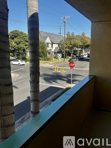 A stop sign is on the corner of a street.