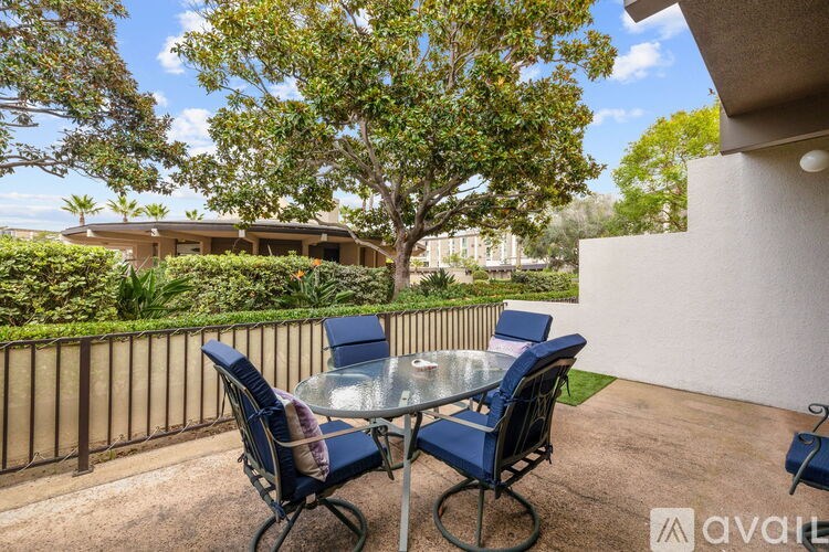 A table with chairs is on a patio.