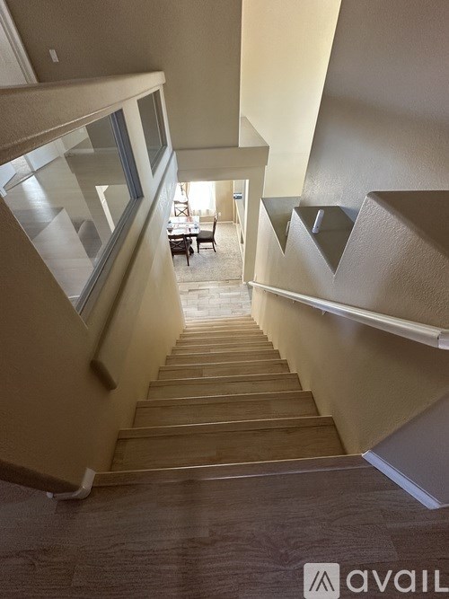 A staircase with wooden steps and a carpeted floor.