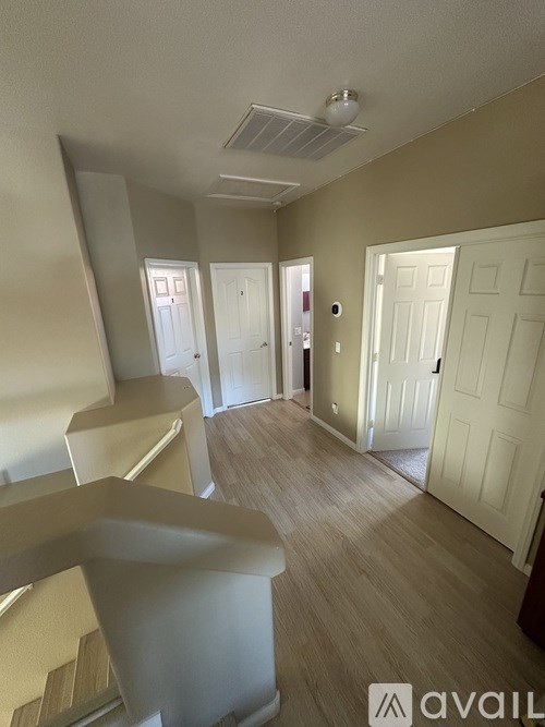 A room with a white door and a window.