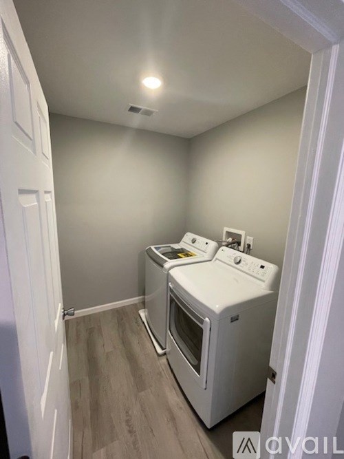 A small kitchen with a white oven and microwave.