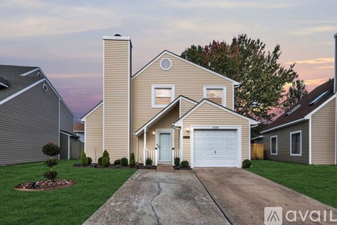 A house with a garage is available for sale.