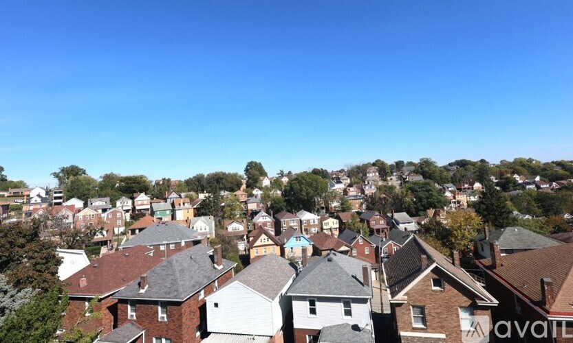 A bird's eye view of a residential neighborhood with houses and trees.