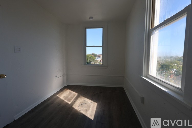 A room with a window and a door.