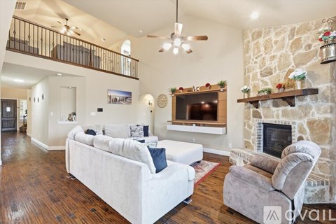 A living room with a fireplace and a couch.