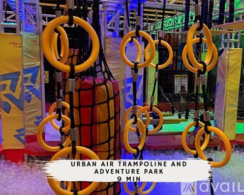 A sign for an Urban Air Trampoline and Adventure Park is displayed.