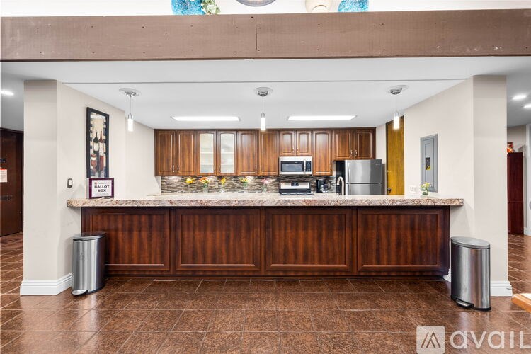 A reception area with a counter and a framed picture on the wall.