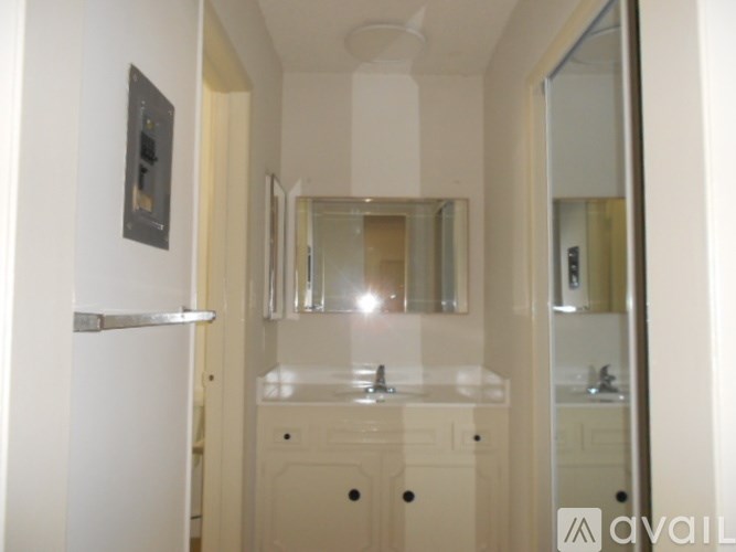 A bathroom with a sink and mirror.