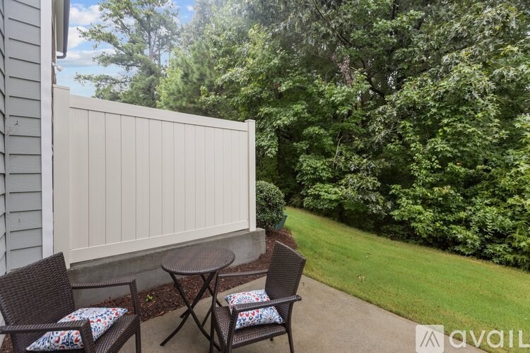 A patio with a table and chairs is available for rent.