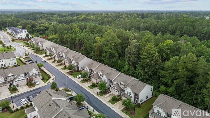 A bird's eye view of a residential area with houses and trees.