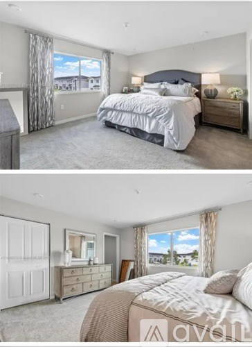 A bedroom with a large bed and a dresser with a mirror.