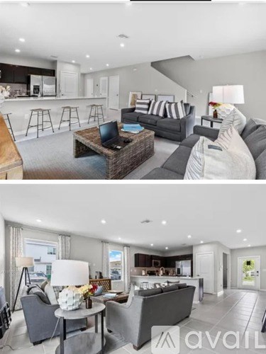 A modern living room with a grey sofa and a coffee table.