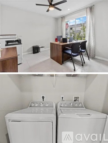 A room with a desk and chairs, and a washing machine.