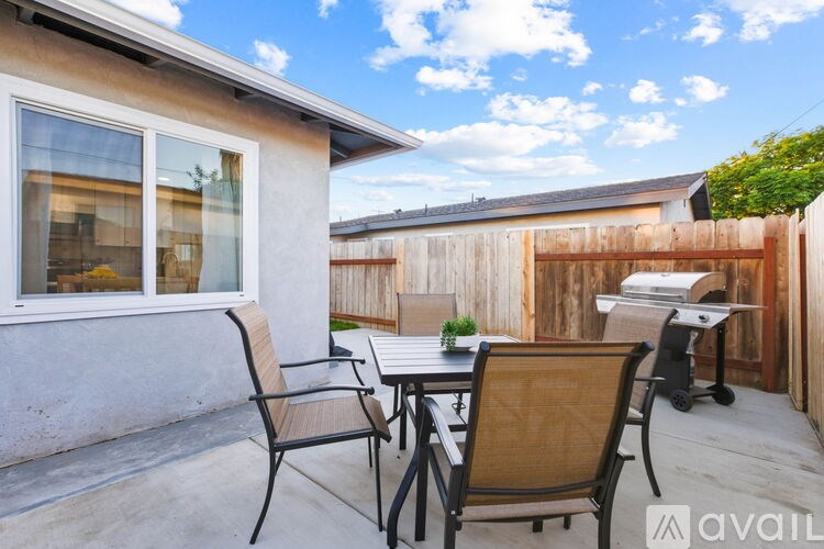 A patio with a table and chairs is available for rent.