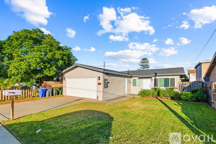 A house with a white garage door is for sale.