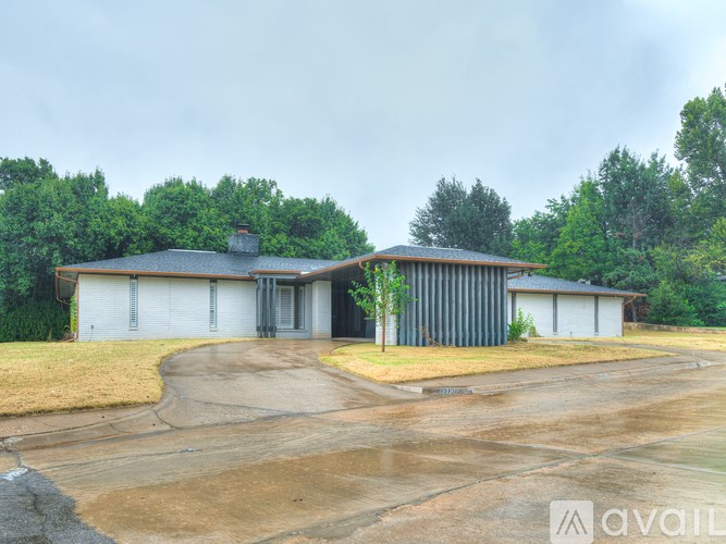 A house with a driveway in front of it.