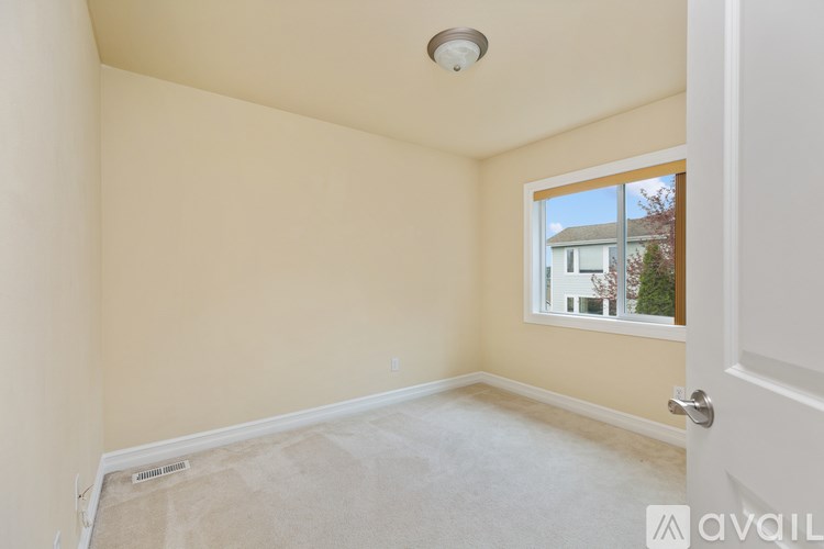 A room with a window and a door.