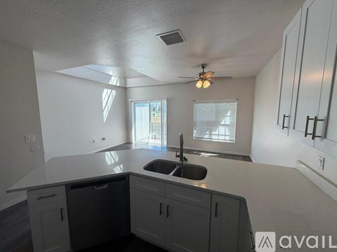 A kitchen with a dishwasher and a sink.