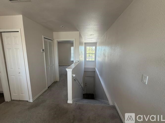 A room with a staircase leading to the second floor.