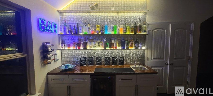 A bar with a neon sign that says "bar" on the wall.