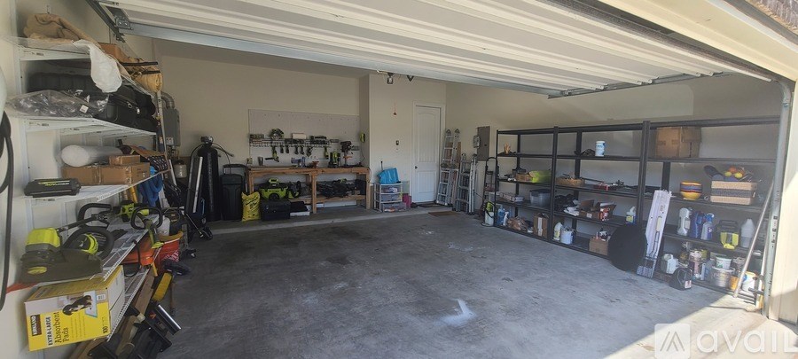 A garage with a lot of tools and equipment.