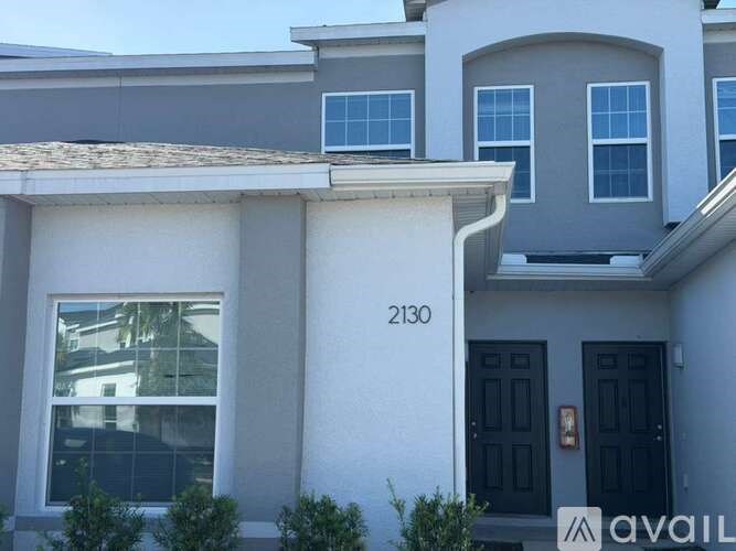 A house with the number 2130 on the front.