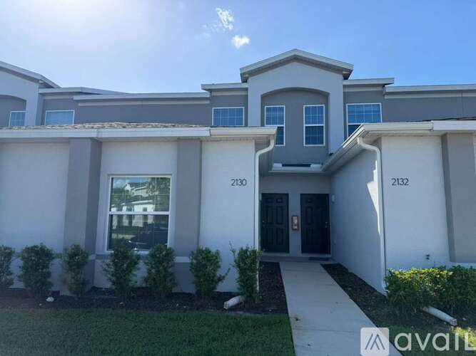 A modern house with the numbers 2130 and 2132 on the front.